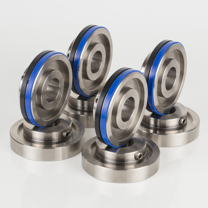 Four stainless creasing hub assemblies with blue bands, group pack shot